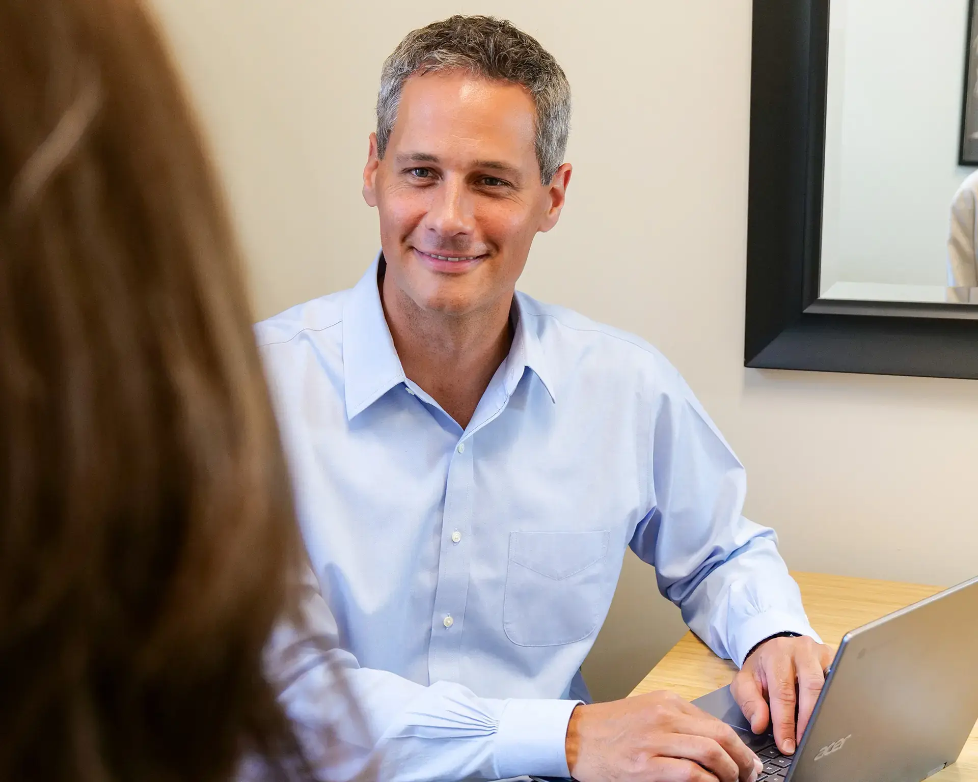 Dr. Penner listening to a patient describe their symptoms